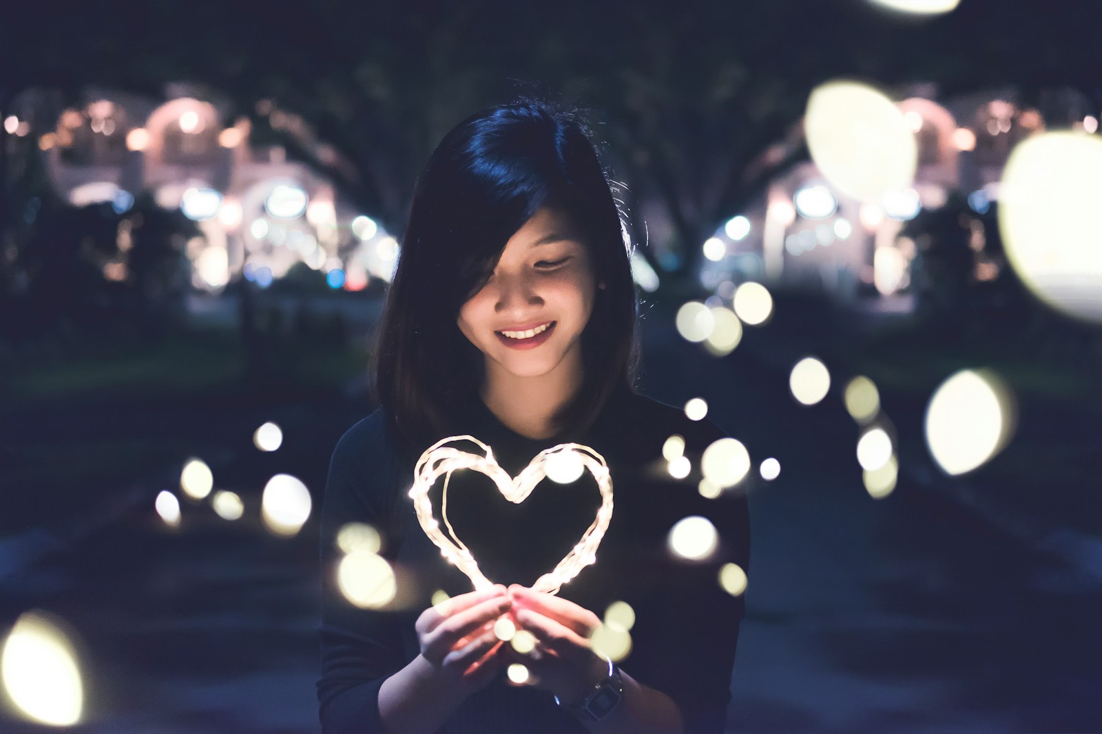 A woman holding a heart symbolizing personal lines insurance